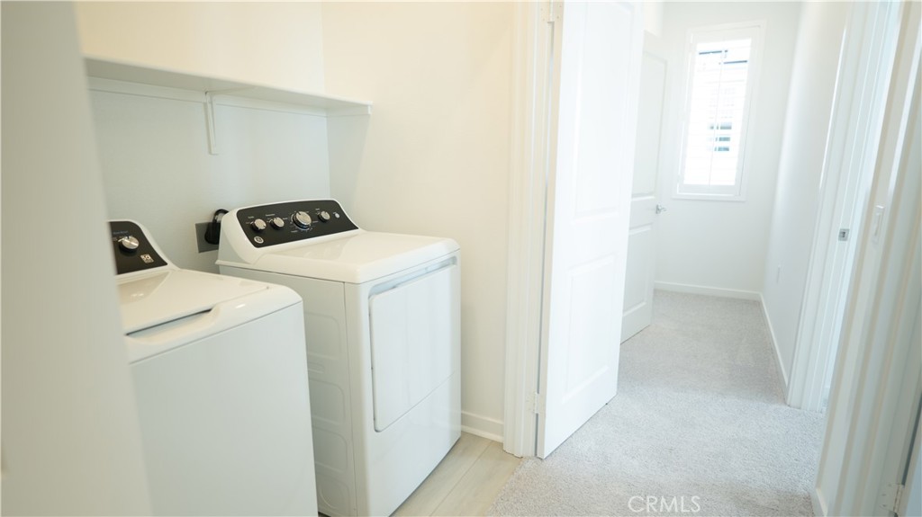 8457 Gabrielino Court Rancho Cucamonga, CA 91730 - Photo 45 of 58 a utility room with dryer and washer