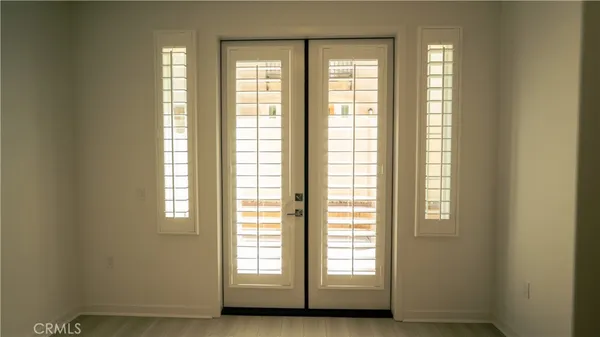 a view of empty room with windows