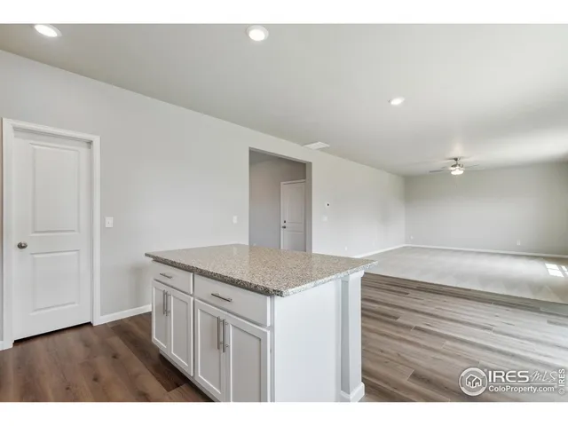 a kitchen view with granite countertop a sink