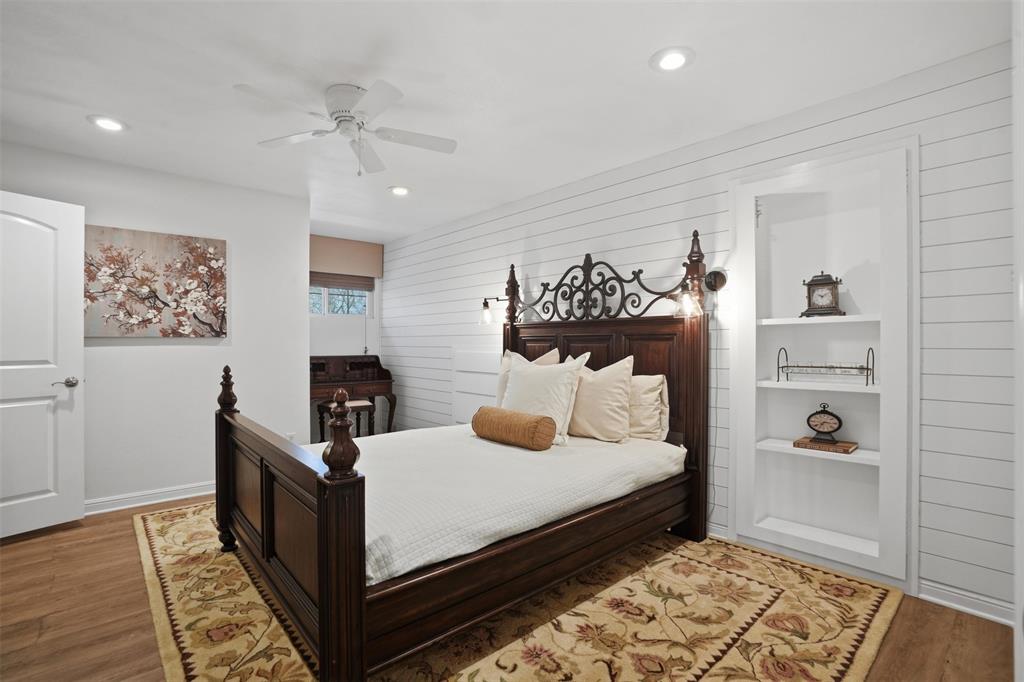 9651 Yellow Rose Lane Pilot Point, TX 76258 - Photo 27 of 38 a bedroom with a bed and wooden floor