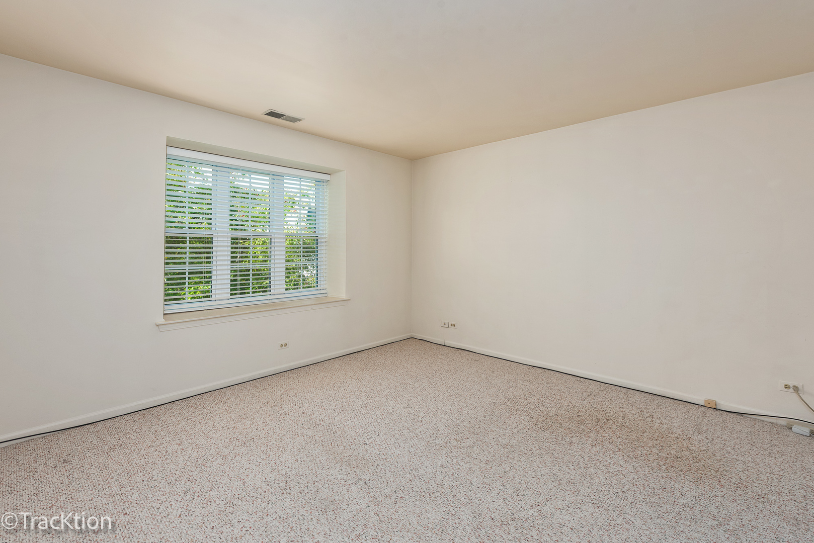 802 Butternut Lane, Unit D Mount Prospect, IL 60056 - Photo 13 of 18 an empty room with a window