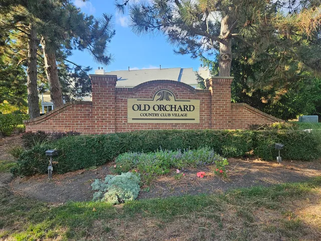 a view of outdoor space with signage and flags