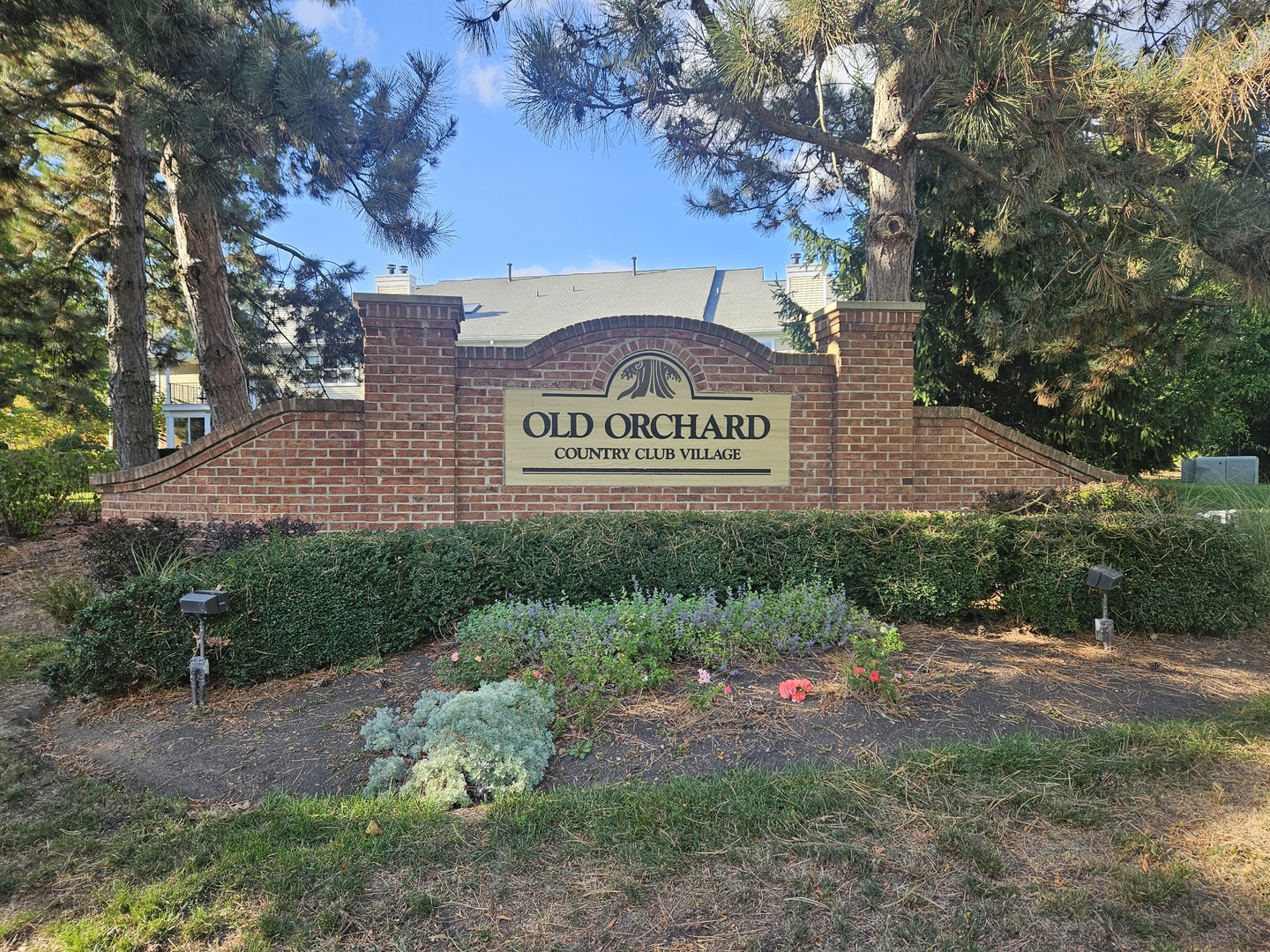 802 Butternut Lane, Unit D Mount Prospect, IL 60056 - Photo 2 of 18 a view of outdoor space with signage and flags