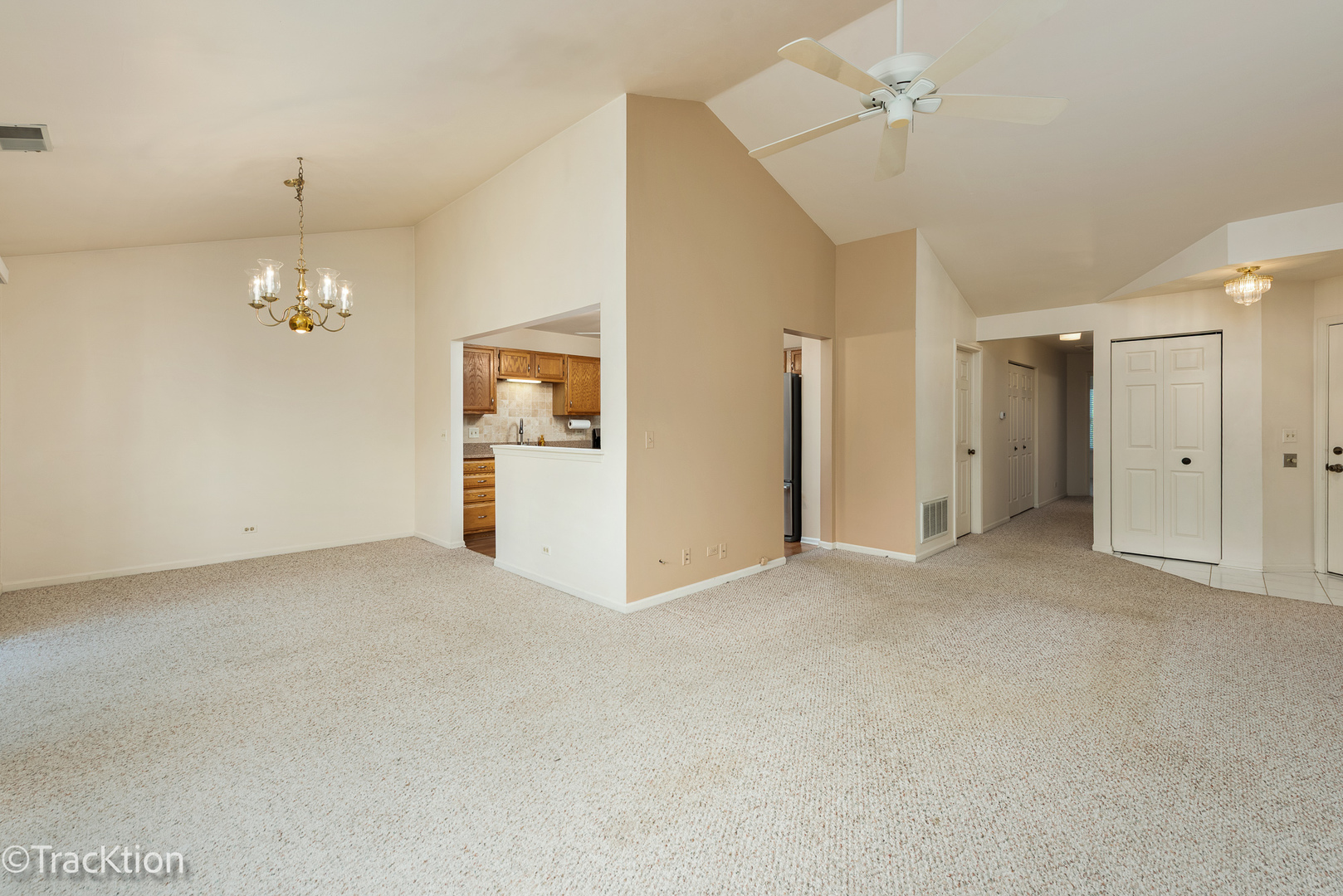 802 Butternut Lane, Unit D Mount Prospect, IL 60056 - Photo 6 of 18 a view of a big room with chandelier fan and windows