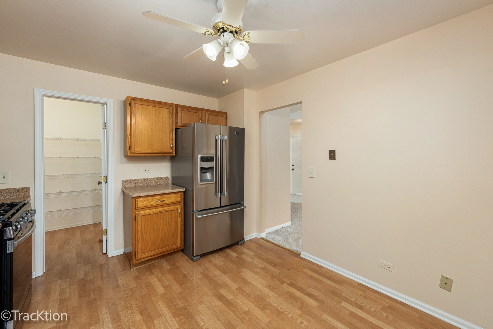 802 Butternut Lane, Unit D Mount Prospect, IL 60056 - Photo 9 of 18 a view of a refrigerator in kitchen and wooden floor