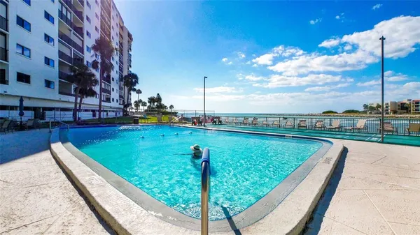 a view of swimming pool with a patio