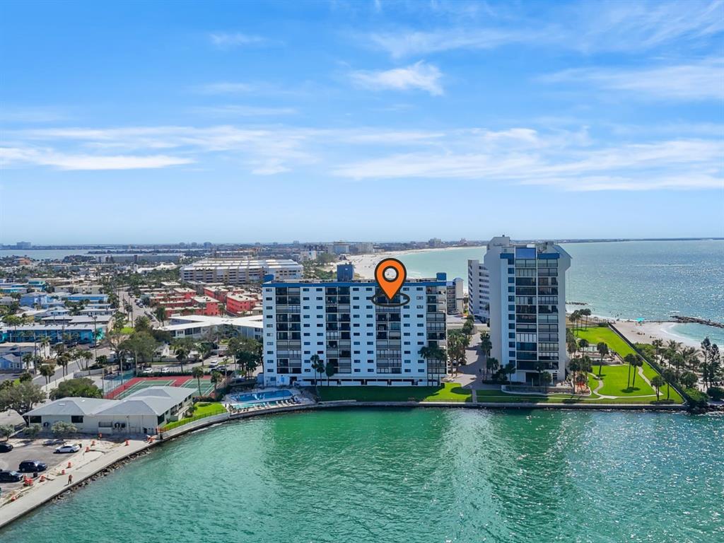 7150 Sunset Way, Unit 903E St. Pete Beach, FL 33706 - Photo 23 of 26 a view of a city with tall buildings