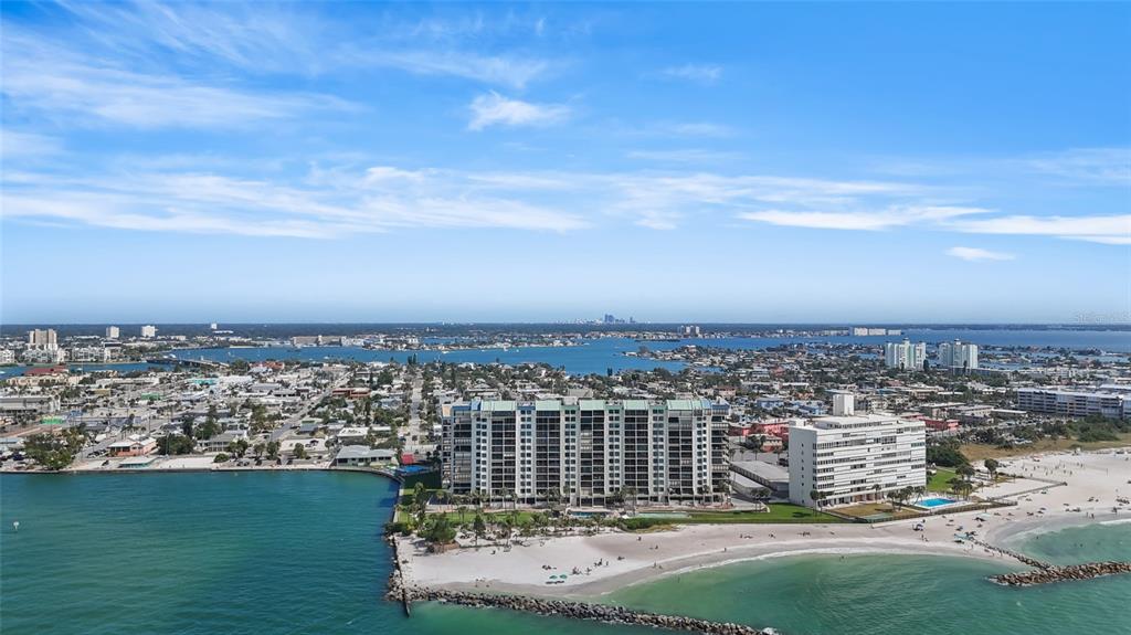 7150 Sunset Way, Unit 903E St. Pete Beach, FL 33706 - Photo 25 of 26 a view of a city with tall buildings in ocean