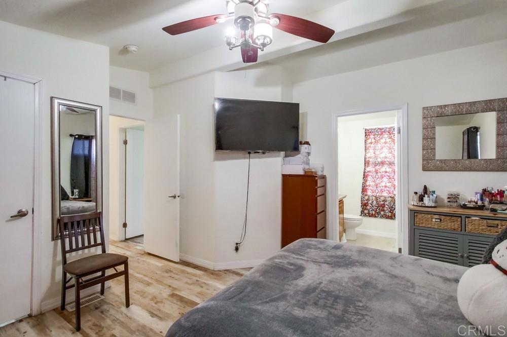 9902 Jamacha Boulevard, Unit SPC 7 Spring Valley, CA 91977 - Photo 21 of 33 a living room with furniture and a flat screen tv