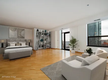 a living room with furniture and large windows