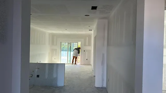 a view of hallway with furniture