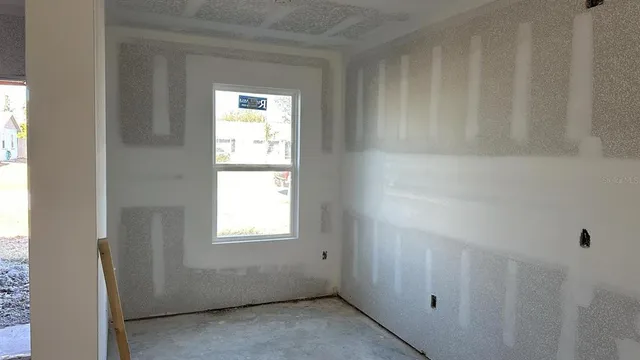 a view of an empty room and window