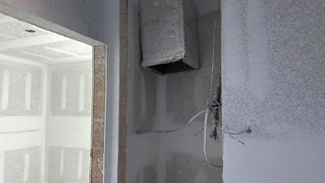 a view of walk in closet with clothes