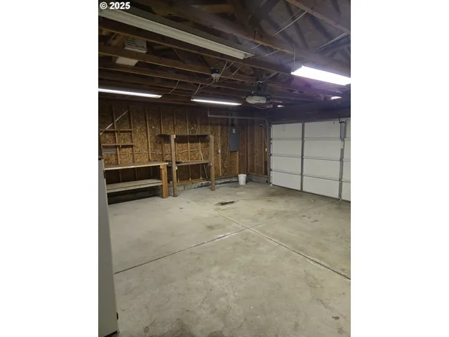 a view of an empty room with washing machine