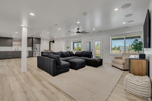 1720 Hillcrest Circle Mapleton, UT 84664 - Photo 69 of 116 Living area with light wood-type flooring, recessed lighting, ceiling fan, and french doors