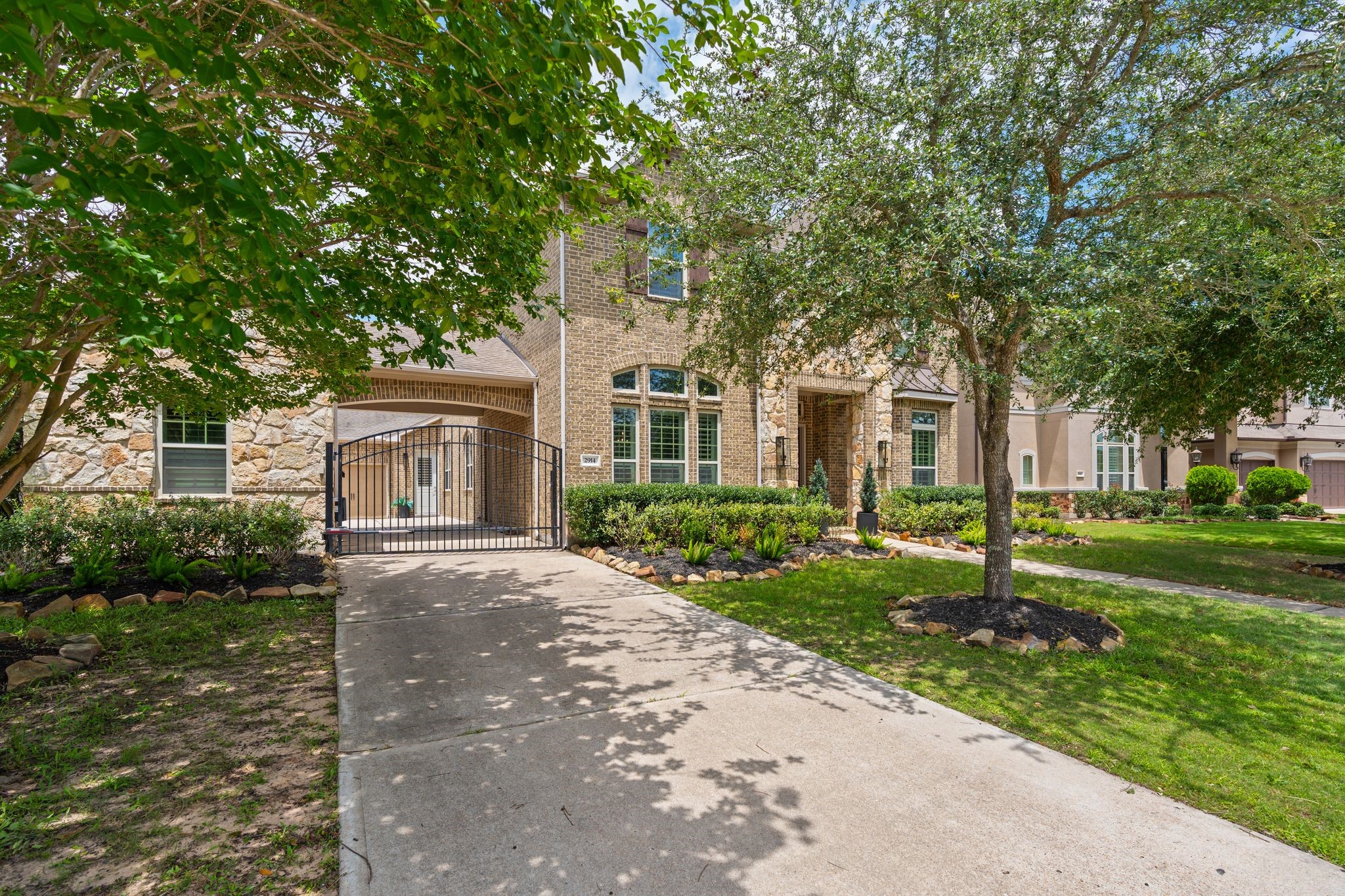 2914 Rutherford Pl Court Katy, TX 77494 - Photo 50 of 50 a front view of a house with a garden and trees