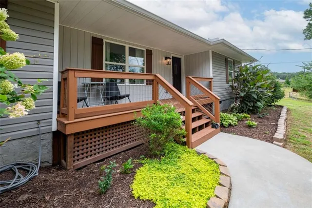 a balcony with lots of green space and plants