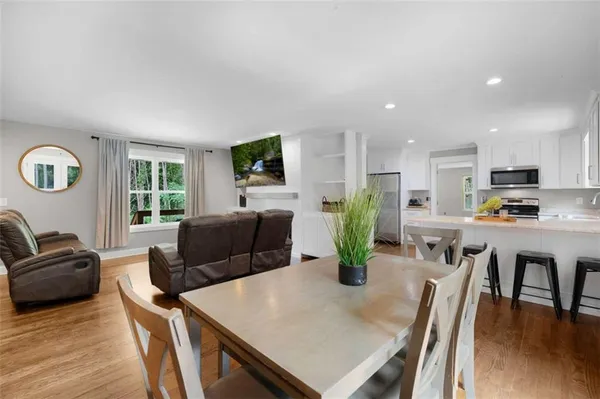 a view of kitchen with dining table and chairs