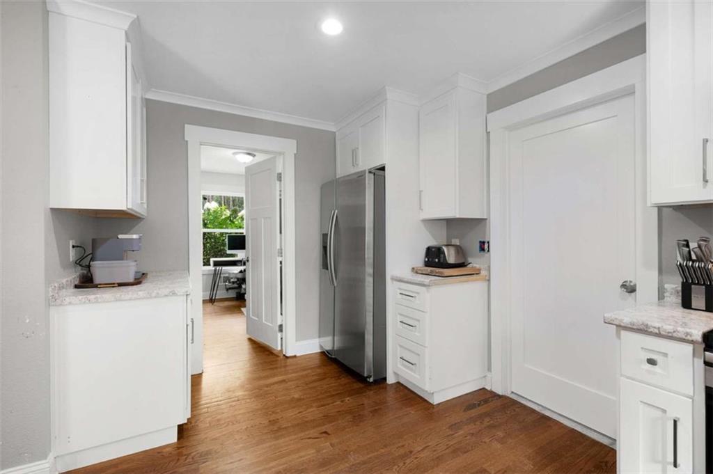 191 Hightower Loop Road Ranger, GA 30734 - Photo 17 of 27 a kitchen with a refrigerator and a stove top oven
