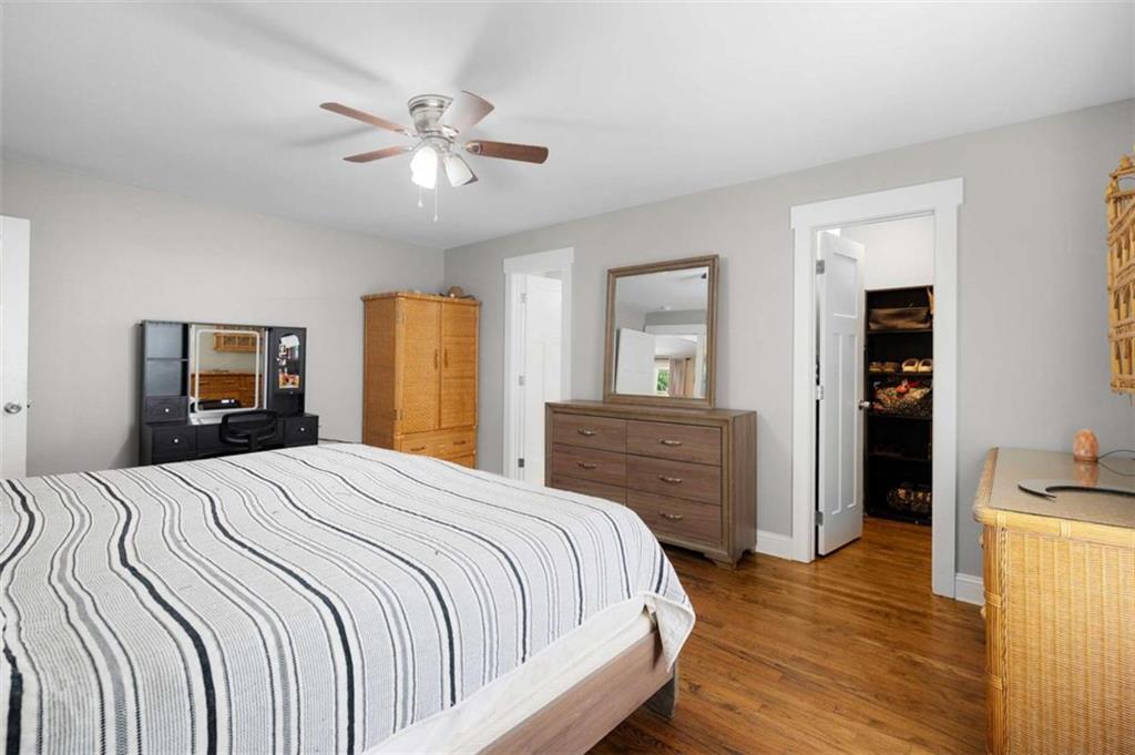 191 Hightower Loop Road Ranger, GA 30734 - Photo 22 of 27 a bedroom with a bed and wooden floor