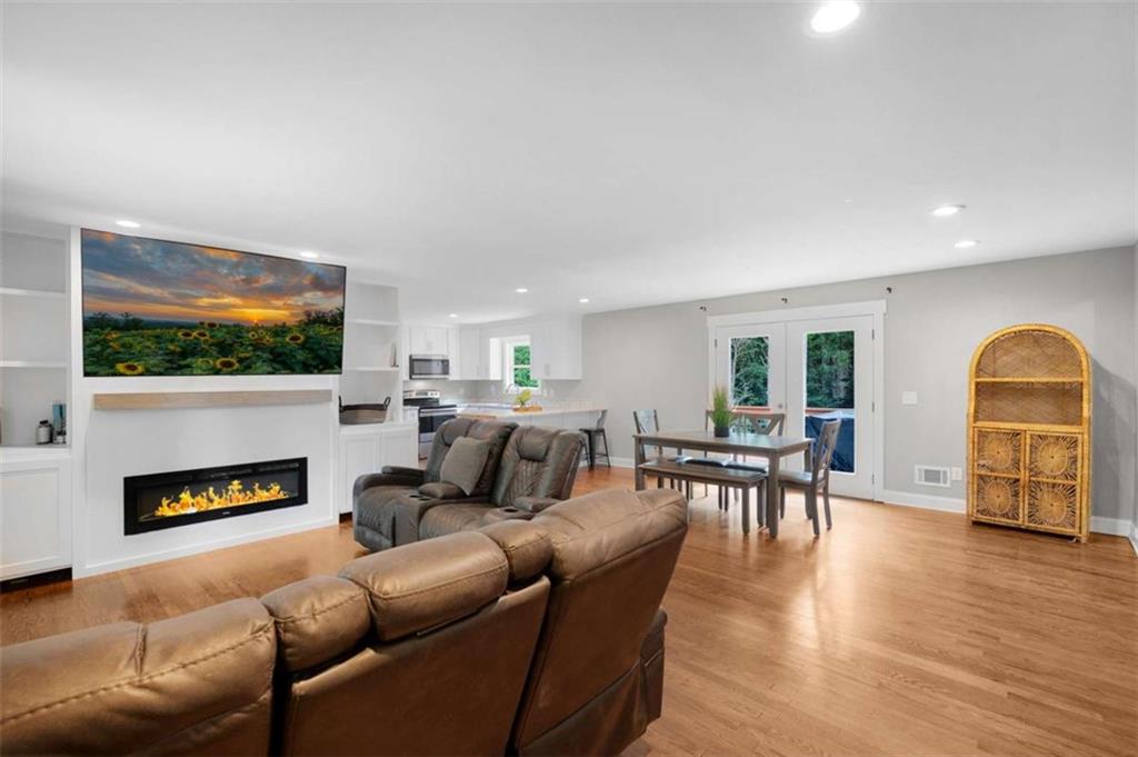 191 Hightower Loop Road Ranger, GA 30734 - Photo 7 of 27 a living room with fireplace furniture and a flat screen tv