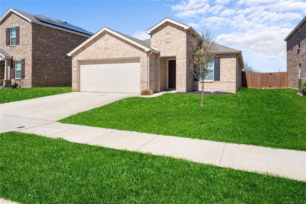 4432 Sagecroft Road Fort Worth, TX 76036 - Photo 2 of 16 Ranch-style home featuring brick siding, a garage, and driveway