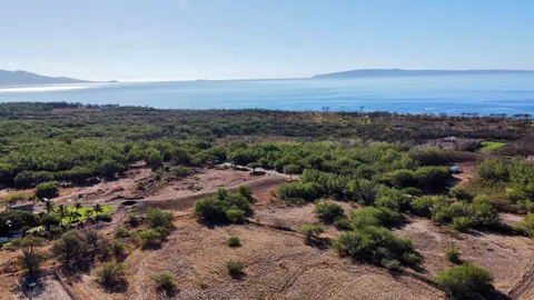 an aerial view of a houses with a yard