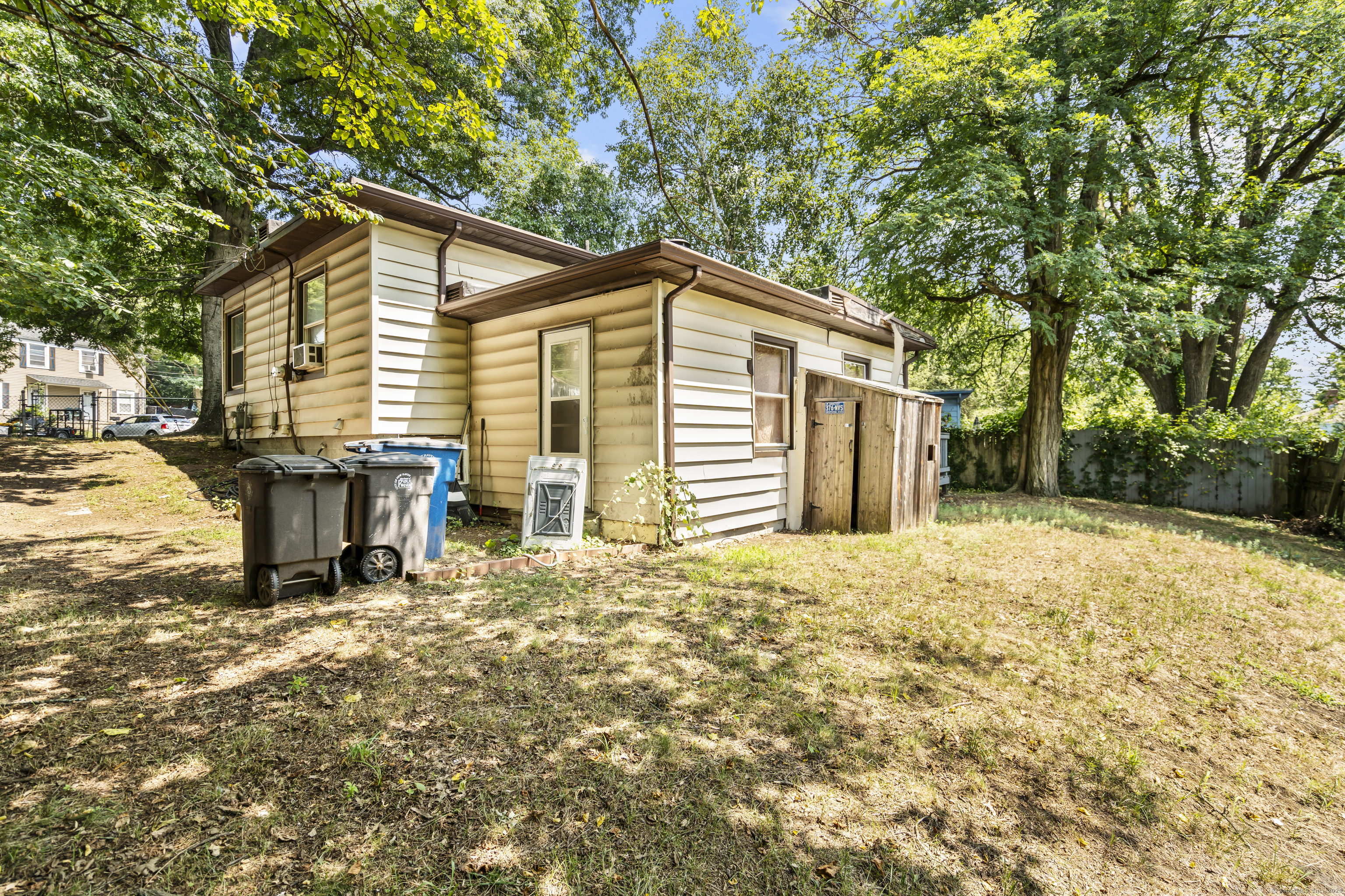 18 Hilltop Road New Haven, CT 06515 - Photo 3 of 13 a backyard of a house with table and chairs