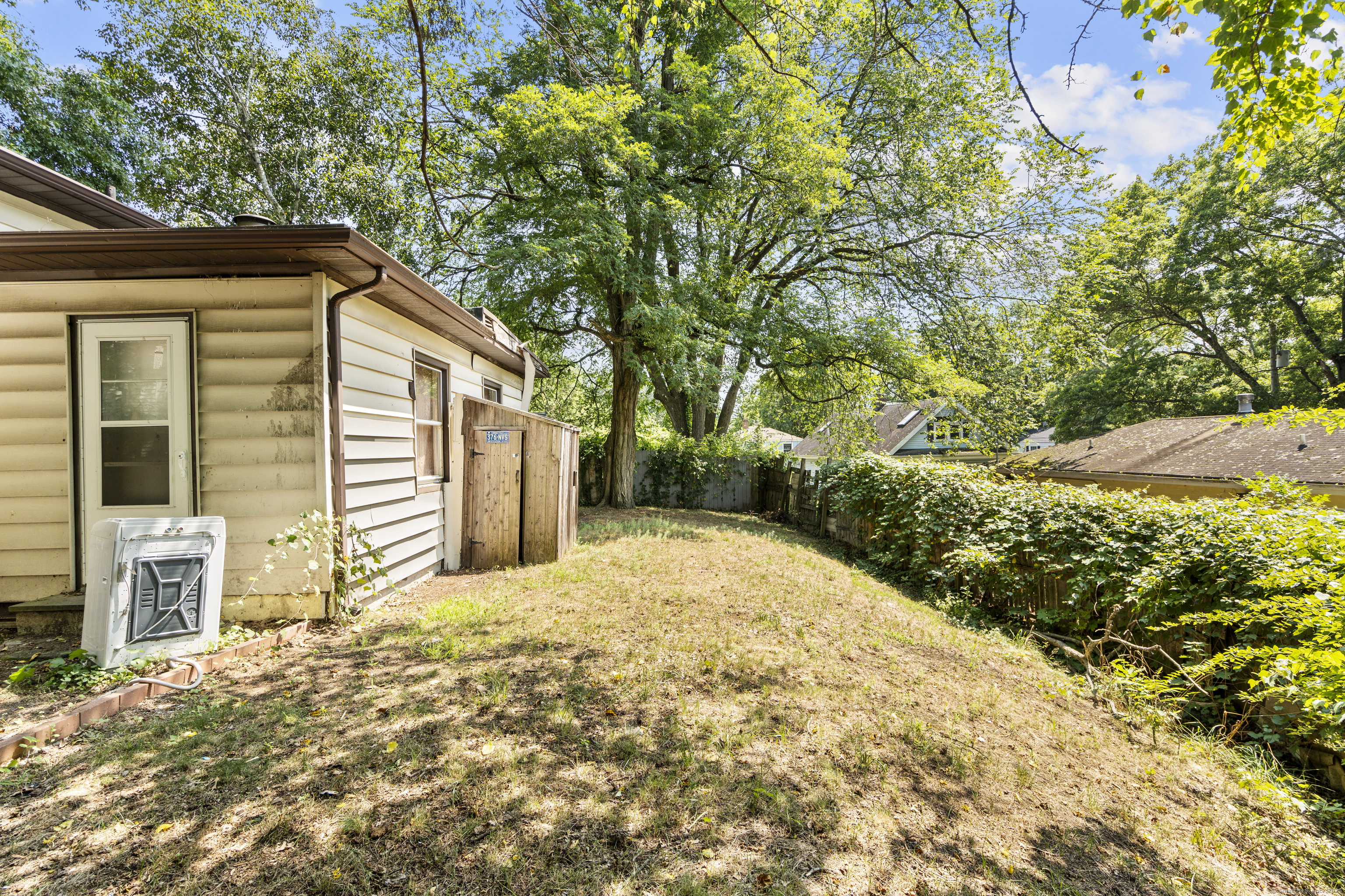 18 Hilltop Road New Haven, CT 06515 - Photo 4 of 13 a view of a house with a yard and pathway