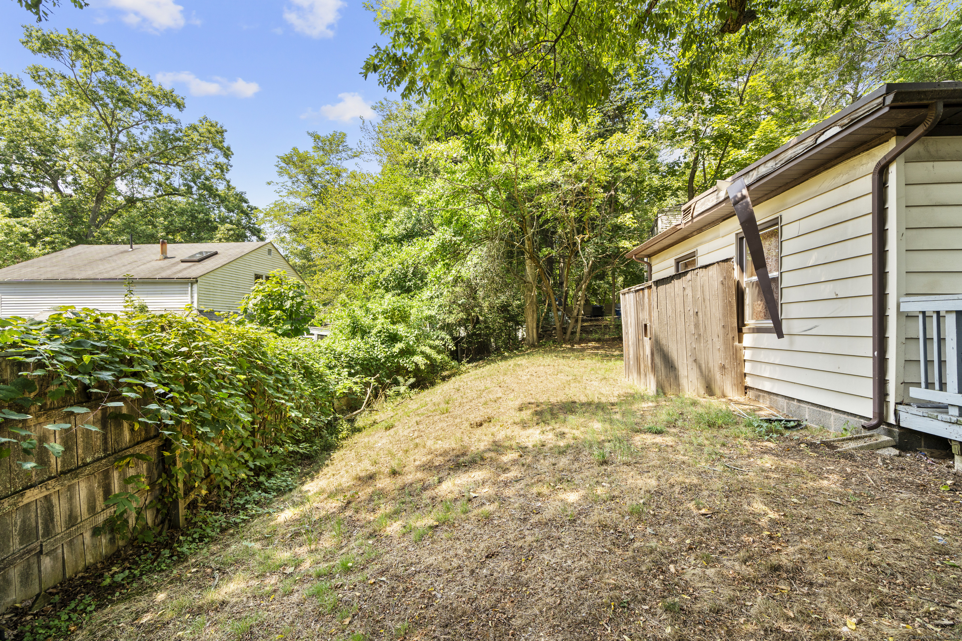 18 Hilltop Road New Haven, CT 06515 - Photo 5 of 13 a view of a backyard of the house