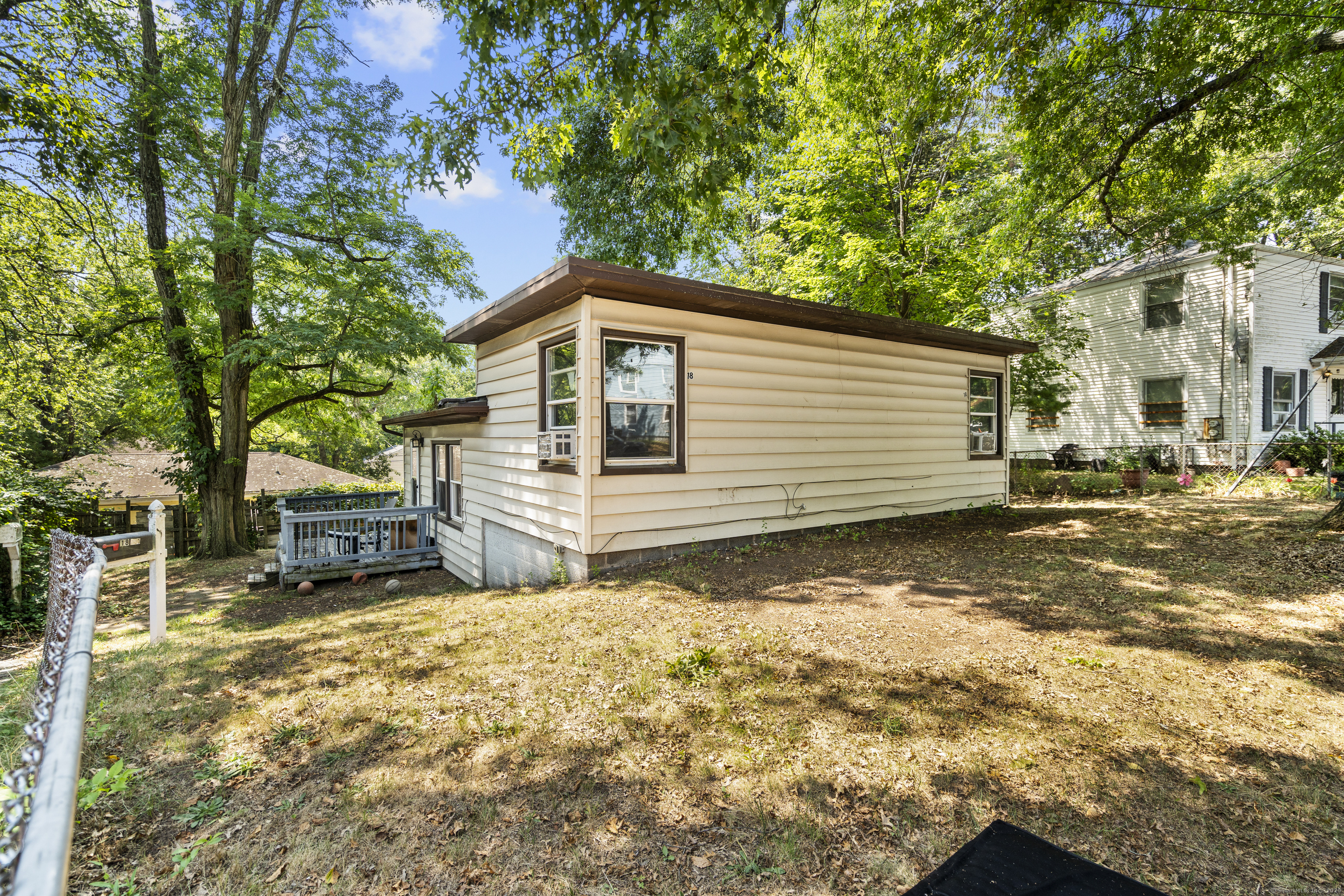 18 Hilltop Road New Haven, CT 06515 - Photo 7 of 13 a view of a house with a patio