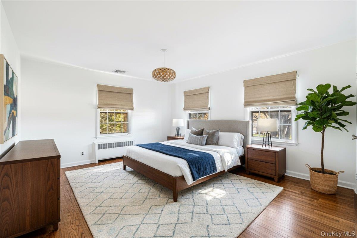 110 Hegemans Lane Glen Head, NY 11545 - Photo 12 of 26 a spacious bedroom with a bed and window