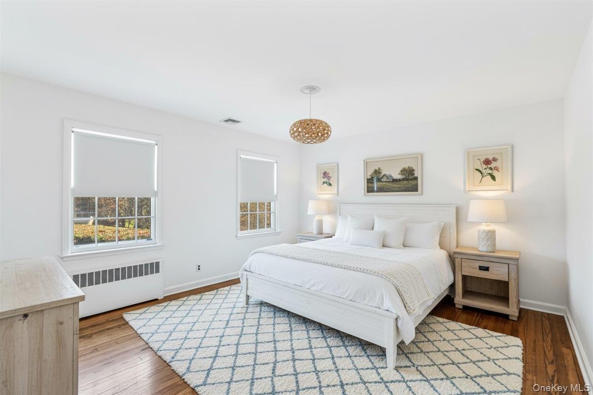 110 Hegemans Lane Glen Head, NY 11545 - Photo 14 of 26 a bedroom with a bed and a window