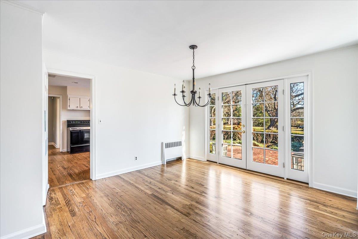 110 Hegemans Lane Glen Head, NY 11545 - Photo 8 of 26 a view of an empty room with wooden floor and a window