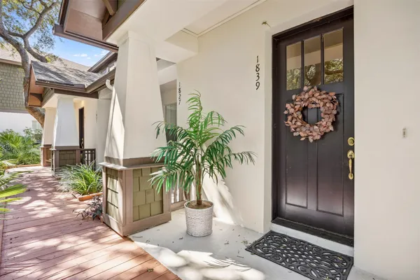 a view of entryway with wooden floor and a potted plant
