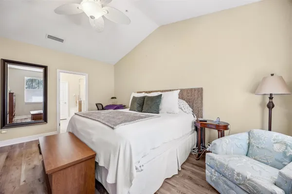 a bedroom with a bed and a couch