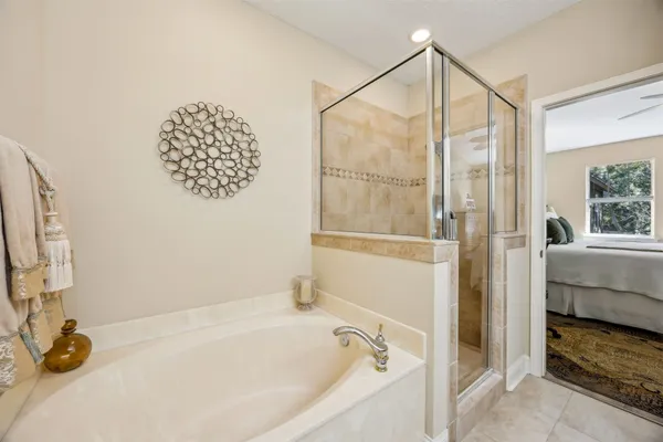 a bathroom with a tub and a shower