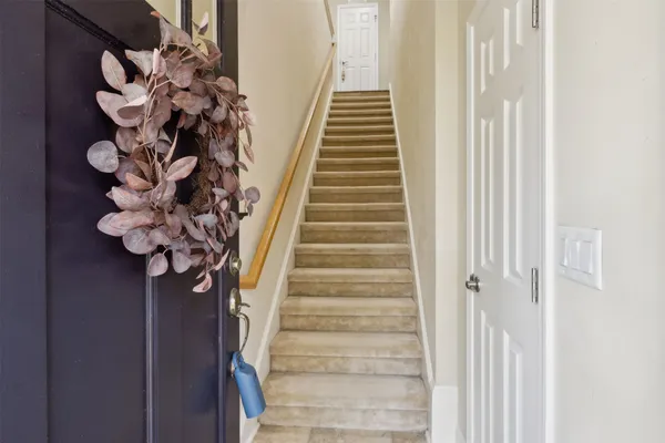 a view of staircase with wooden floor