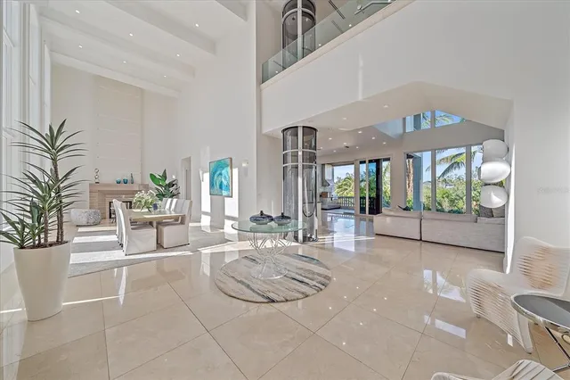a kitchen with stainless steel appliances granite countertop a sink and a refrigerator