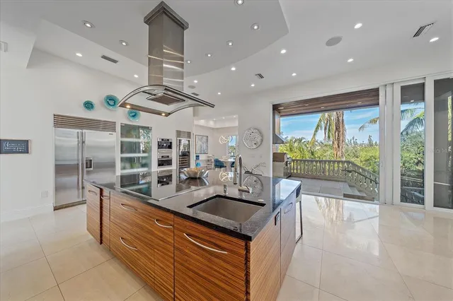 a bathroom with a granite countertop toilet sink and mirror