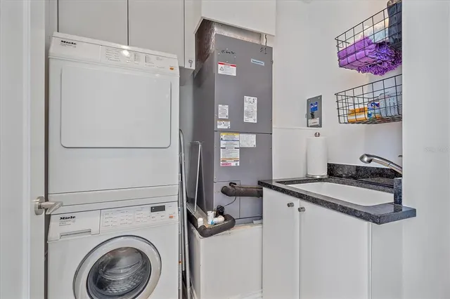 a bedroom with a bed and a lamp