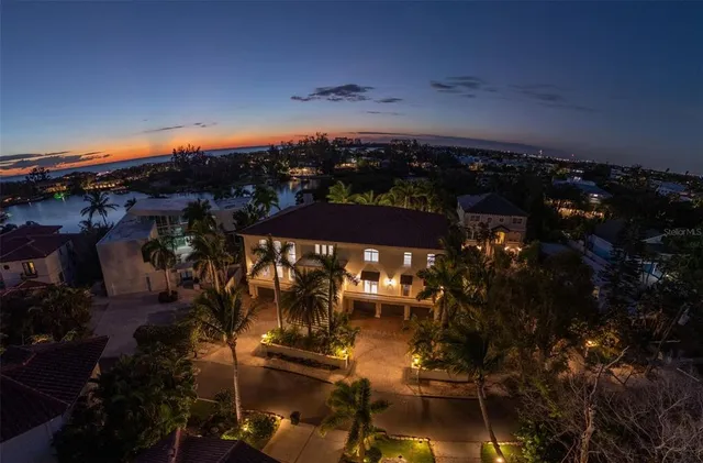a view of a house with a yard and a garden