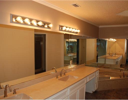 7202 Sandpiper Drive Corpus Christi, TX 78412 - Photo 7 of 10 a bathroom with a sink and a mirror