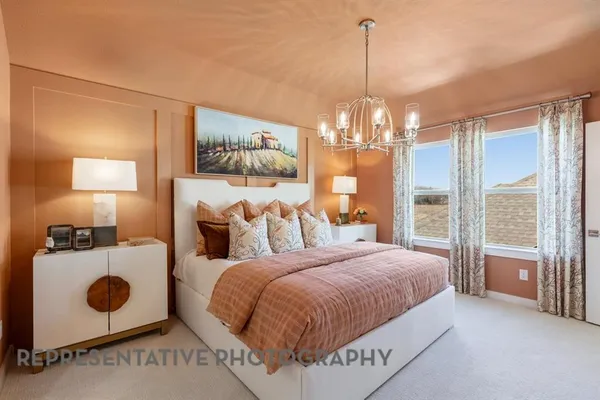 a bedroom with bed and window