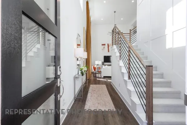 a view of living room with furniture and a chandelier