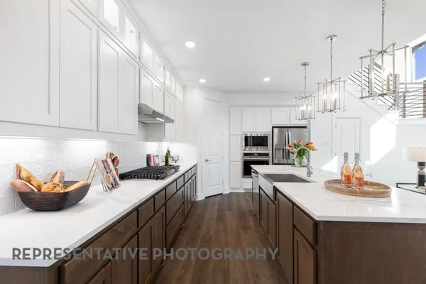 a kitchen with a table and chairs in it