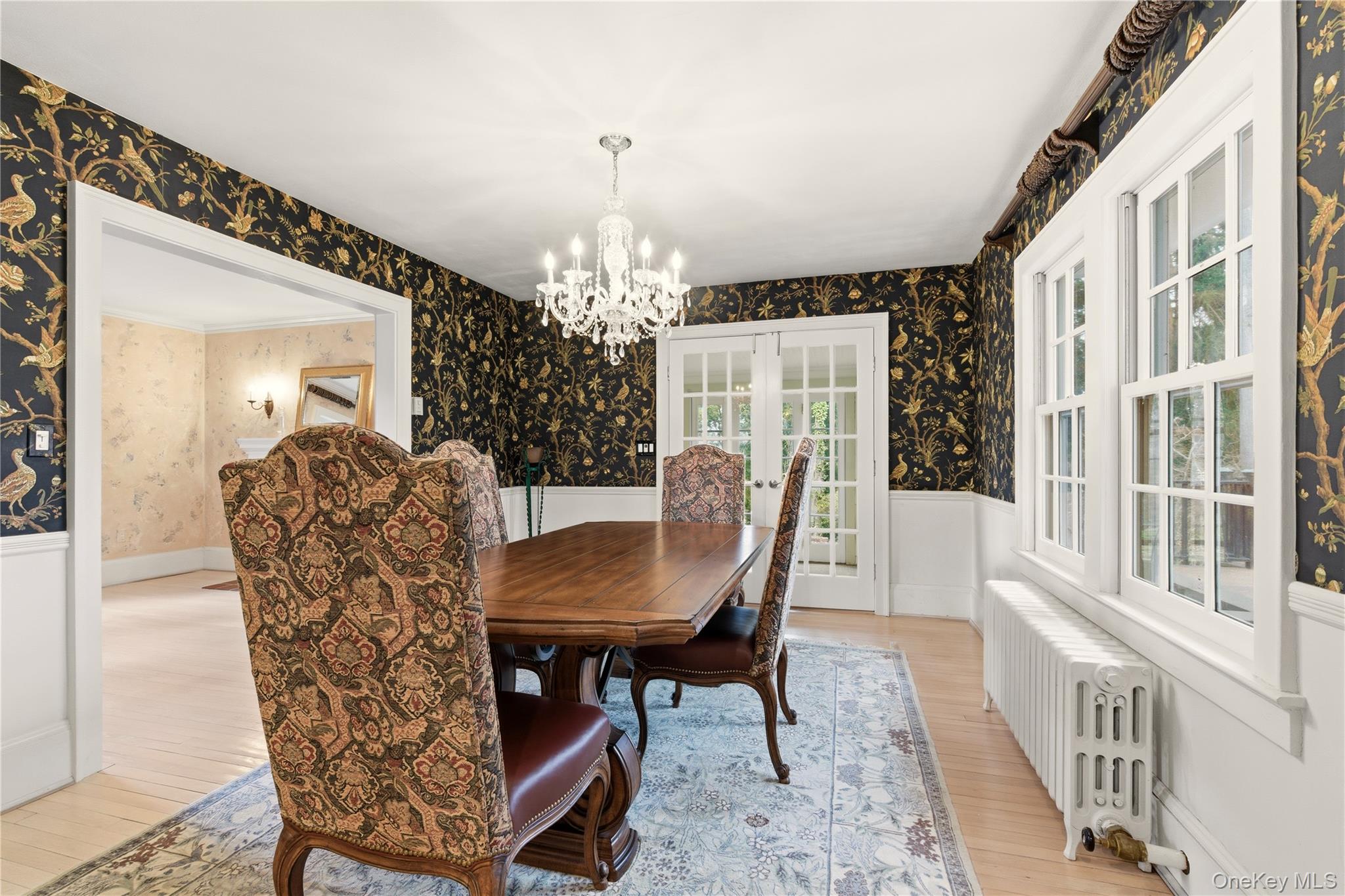 104 Fort Hill Road Huntington, NY 11743 - Photo 15 of 32 a view of a dining room with furniture and a chandelier
