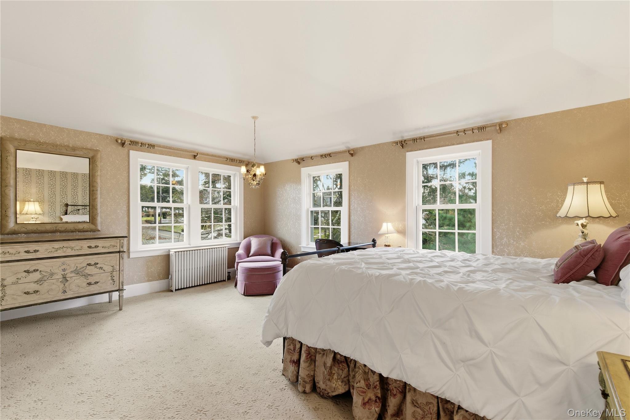 104 Fort Hill Road Huntington, NY 11743 - Photo 18 of 32 a spacious bedroom with a bed and wooden floor