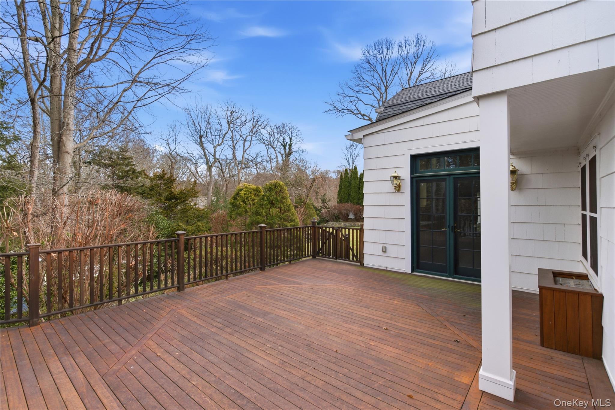 104 Fort Hill Road Huntington, NY 11743 - Photo 28 of 32 a view of a backyard with wooden fence and large trees