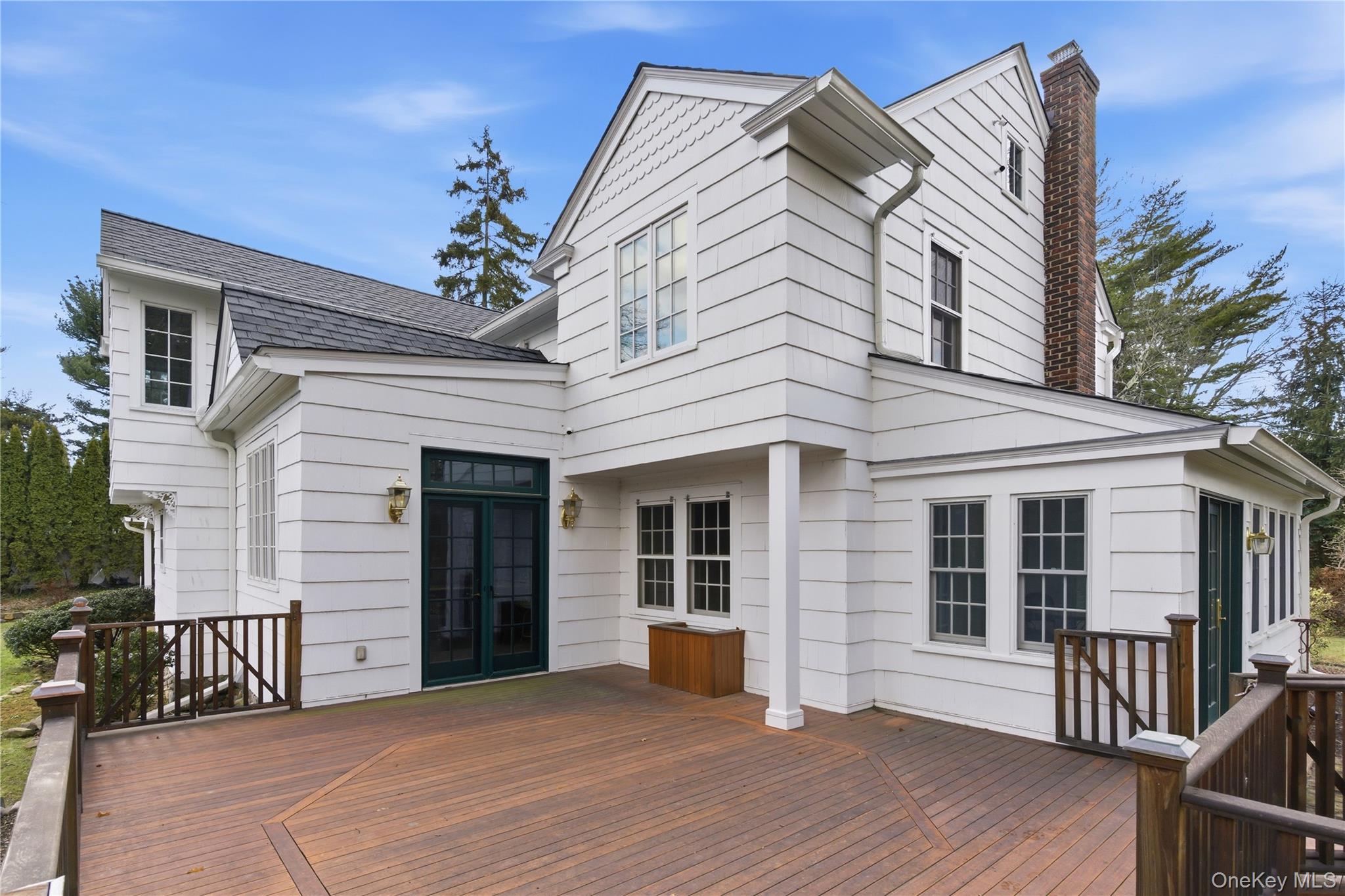 104 Fort Hill Road Huntington, NY 11743 - Photo 29 of 32 a view of a house with a balcony and wooden floor